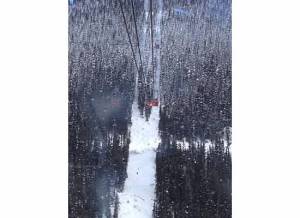 View through glass bottom of Peak 2 Peak Gondola, 1,500 feet in the air above Whistler/Blackcomb Ski Resort.