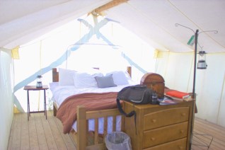 Our Deluxe Tent. Where is our rug? Baseboards? Our table and safari chairs? Is the lantern hanging from an IV rack? 